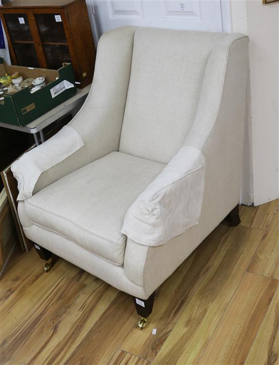 A modern mahogany framed lounge armchair